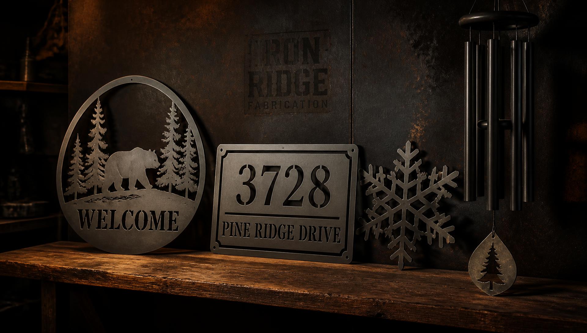 Laser-cut metal welcome sign, address plaque, snowflake ornament and custom metal decor on a rustic shelf